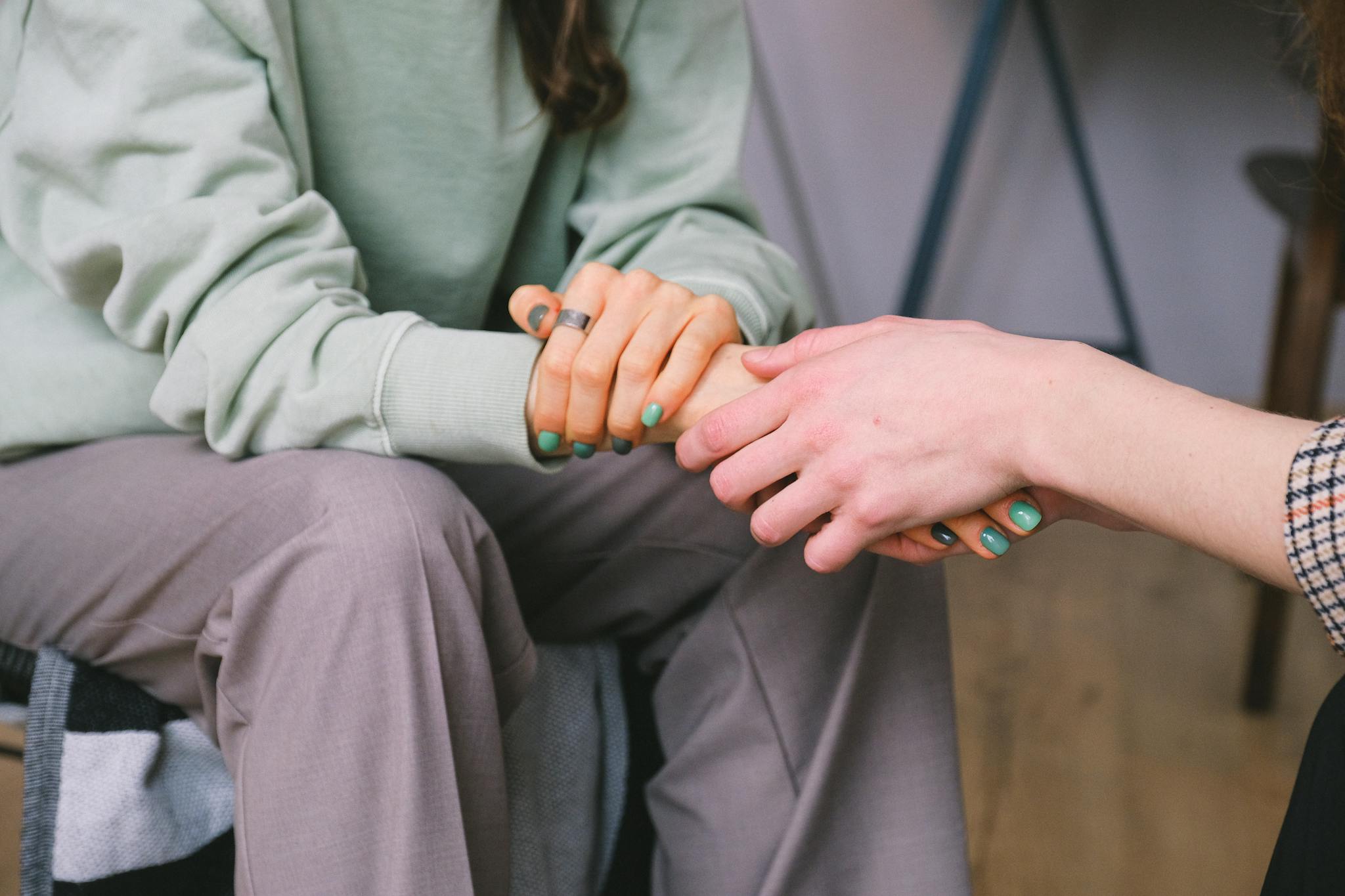 Closeup of couple's hands holding linking to Bachelor of Science in Christian Counseling at Northeastern Baptist College